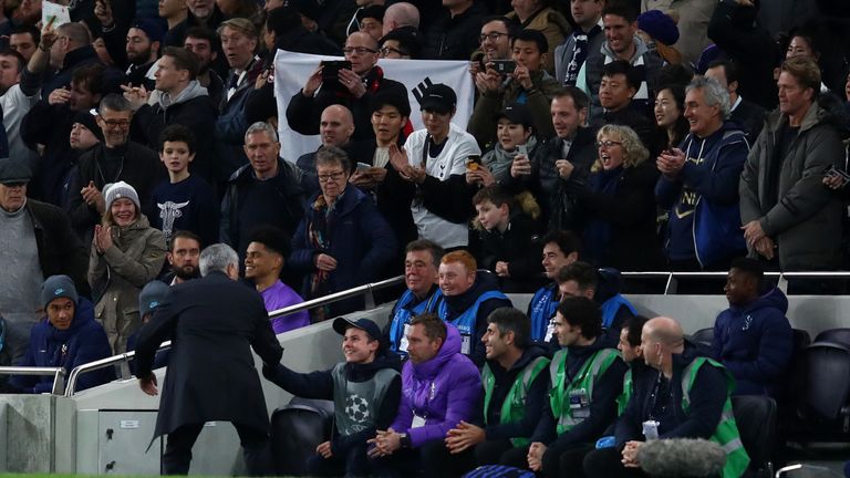 Jose Mourinho, Manager of Tottenham Hotspur shakes hands with a ball boy as he celebrates his team&#39;s second goal during the UEFA Champions League group B match between Tottenham Hotspur and Olympiakos FC at Tottenham Hotspur Stadium 
