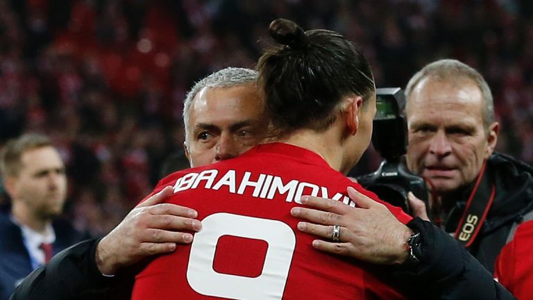 Manchester United&#39;s Swedish striker Zlatan Ibrahimovic embraces Manchester United&#39;s Portuguese manager Jose Mourinho 