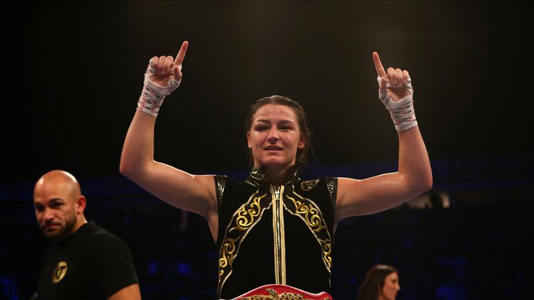 Katie Taylor wears the WBO belt after becoming a two-weight champion