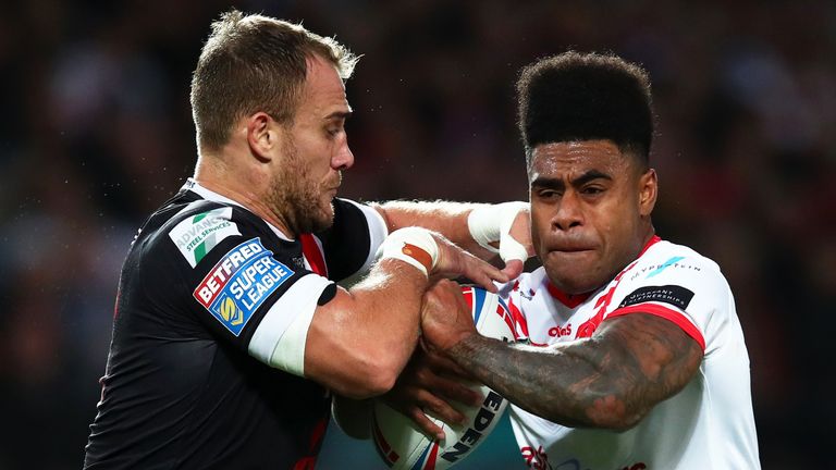 MANCHESTER, ENGLAND - OCTOBER 12: Kevin Naiqama of St Helens is tackled by Lee Mossop of Salford Red Devils during Betfred Super League Grand Final between St Helens and Salford Red Devils at Old Trafford on October 12, 2019 in Manchester, England. (Photo by Clive Brunskill/Getty Images)