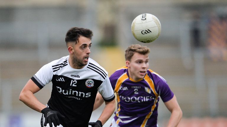Ryan Johnston of Kilcoo in action against  Jack Love of Derrygonnelly