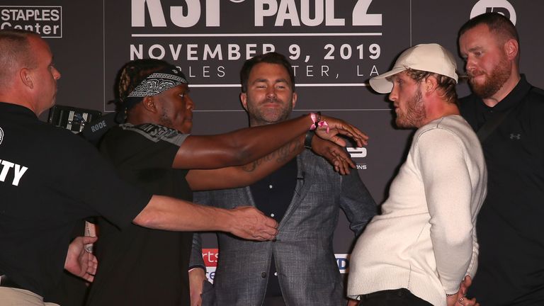 KSI shoves Logan Paul at the final press conference before their much-anticipated boxing rematch on Saturday night.