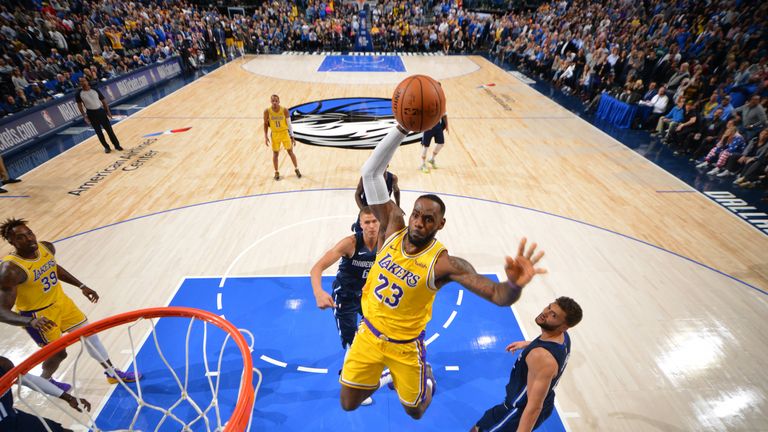 LeBron James  of the Los Angeles Lakers dunks the ball against the Dallas Mavericks