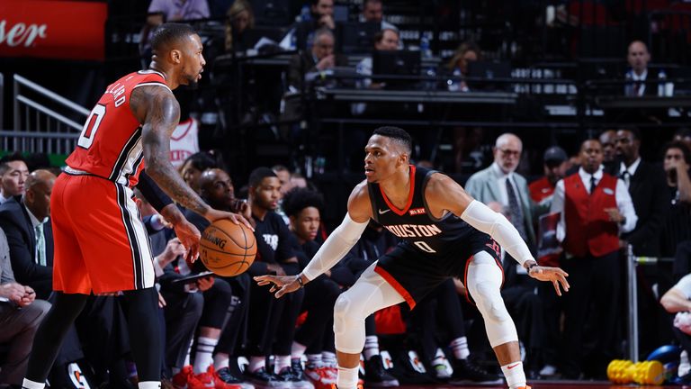 Russell Westbrook of the Houston Rockets plays defense against Damian Lillard of the Portland Trail Blazers