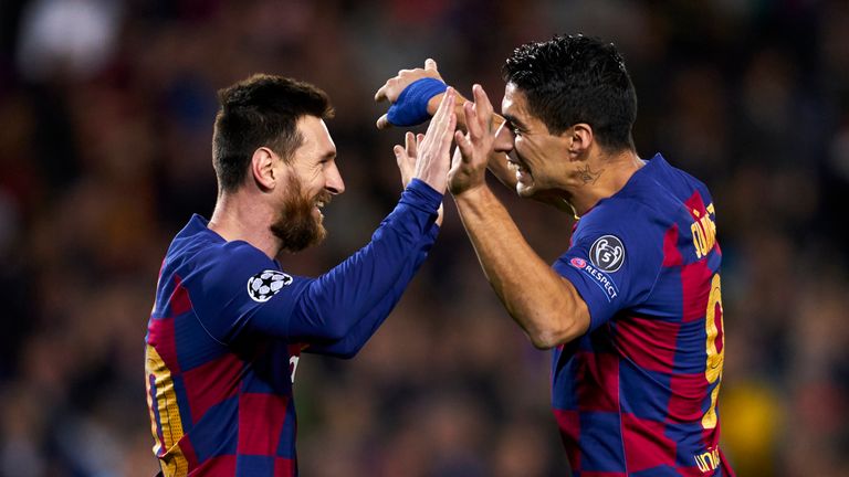 Lionel Messi celebrates with Luis Suarez after scoring Barcelona's second goal against Borussia Dortmund