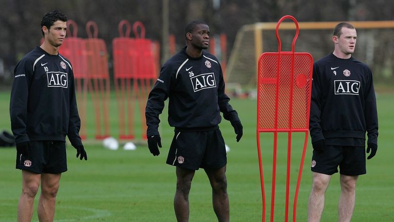 Saha with Ronaldo (left) and Rooney (right) during his Manchester United days