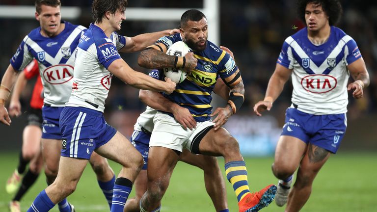 SYDNEY, AUSTRALIA - AUGUST 22: Manu Ma'u of the Eels is tackled during the round 23 NRL match between the Parramatta Eels and the Canterbury Bulldogs at Bankwest Stadium on August 22, 2019 in Sydney, Australia. (Photo by Mark Metcalfe/Getty Images)