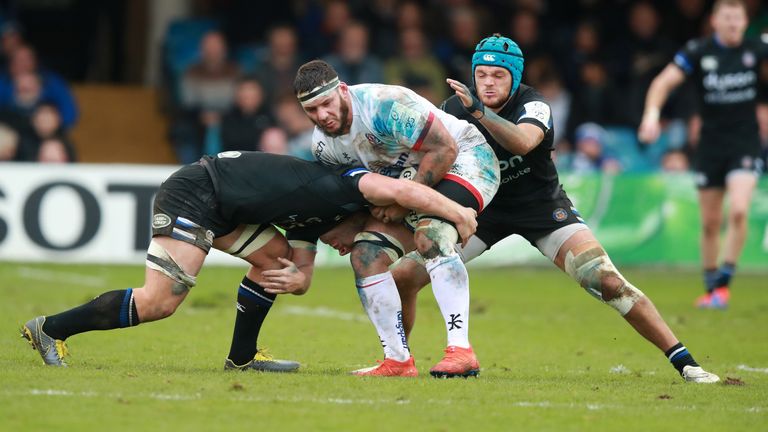 BATH, ENGLAND - NOVEMBER 16: Marcell Coetzee of Ulster is tackled by Sam Underhill and Zach Mercer (R) during the Heineken Champions Cup Round 1 match between Bath Rugby and Ulster Rugby at the Recreation Ground on November 16, 2019 in Bath, England. (Photo by David Rogers/Getty Images)