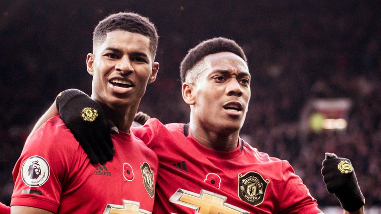 Marcus Rashford celebrates with Anthony Martial after scoring for Manchester United against Brighton