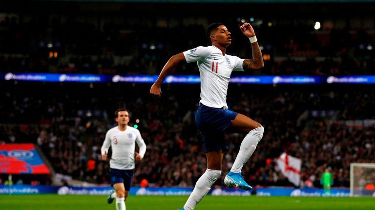 Marcus Rashford celebrates scoring for England against Montenegro