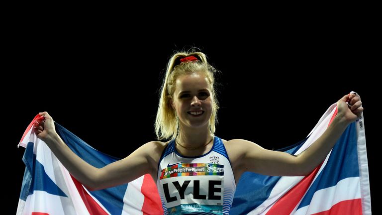 Maria Lyle poses with Union Flag after winning gold in the T35 100m at the World Para-Athletics Championships in Dubai