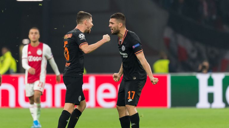 Chelsea midfielders Jorginho and Mateo Kovacic celebrate winning at Ajax