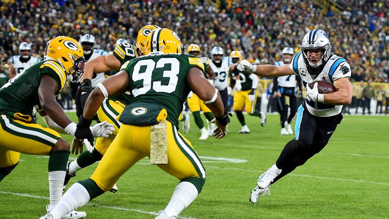 Christian McCaffrey of the Carolina Panthers runs the ball against the Green Bay Packers during the second quarter in the game at Lambeau Field 