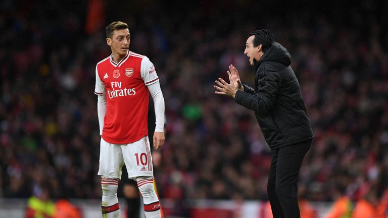 Unai Emery issues instructions to Mesut Ozil during Arsenal's game against Wolves at the Emirates Stadium