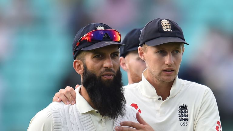 England's captain Joe Root (R) chats to England's Moeen Ali as they leave the field at close of play on the fourth day of the third Test match between England and South Africa at The Ova on July 30, 2017