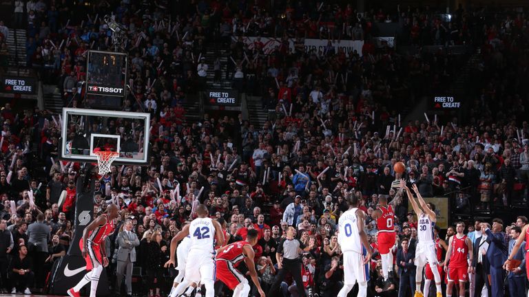 Furkan Korkmaz gets his three up over Damian Lillard to win the game