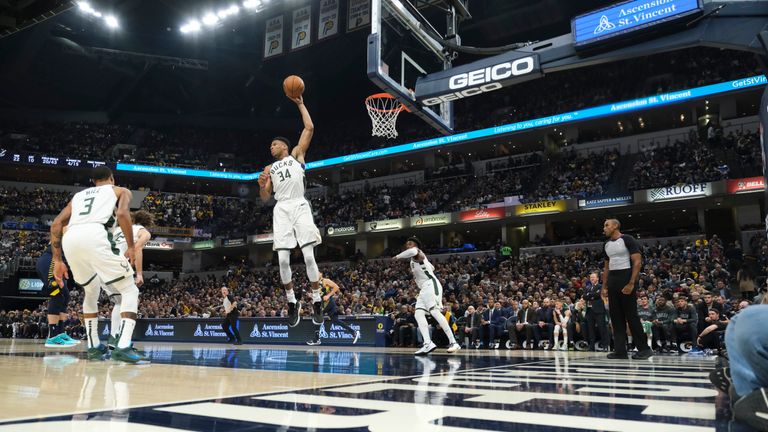Giannis Antetokounmpo rises up to grab a rebound against the Pacers