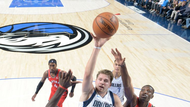 Luka Doncic rises to score against the Raptors