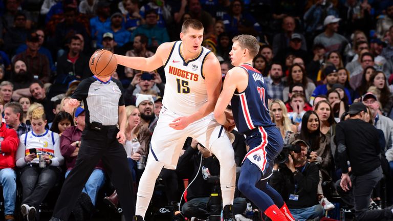 DENVER, CO - NOVEMBER 26: Nikola Jokic #15 of the Denver Nuggets handles the ball against the Washington Wizards on November 26, 2019 at the Pepsi Center in Denver, Colorado. NOTE TO USER: User expressly acknowledges and agrees that, by downloading and/or using this Photograph, user is consenting to the terms and conditions of the Getty Images License Agreement. Mandatory Copyright Notice: Copyright 2019 NBAE (Photo by Bart Young/NBAE via Getty Images)