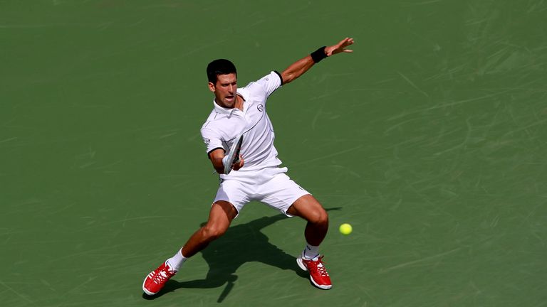 Novak Djokovic of Serbia hits a forehand return against Roger Federer of Switzerland during Day Thirteen of the 2011 US Open at the USTA Billie Jean King National Tennis Center on September 10, 2011 in the Flushing neighborhood of the Queens borough of New York City