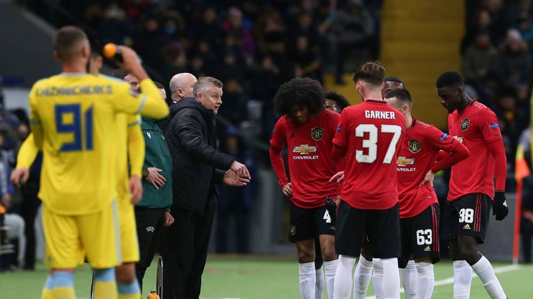Ole Gunnar Solskjaer speaks to his players during a break in play