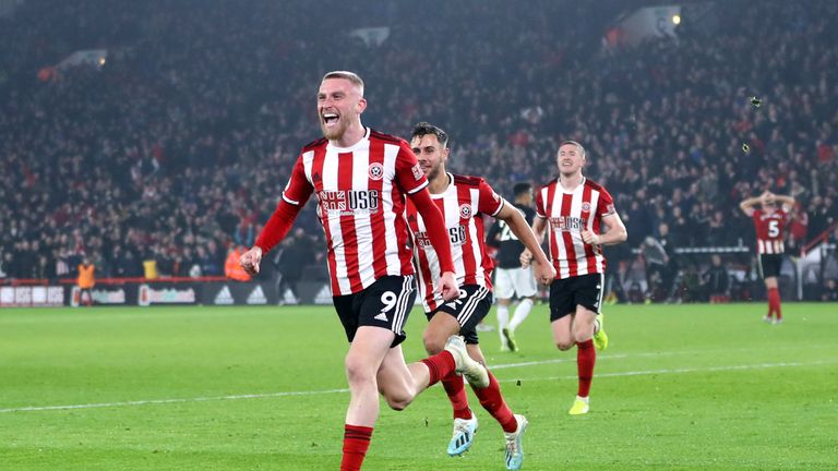 Oli McBurnie celebrates scoring the equaliser against Man Utd