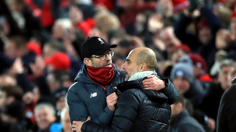 Liverpool manager Jurgen Klopp embraces Manchester City boss Pep Guardiola