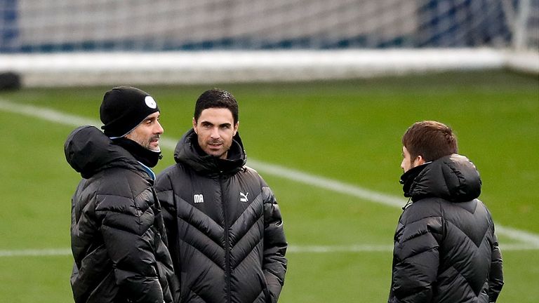 Pep Guardiola with assistant Mikel Arteta during a training session at the City Football Academy