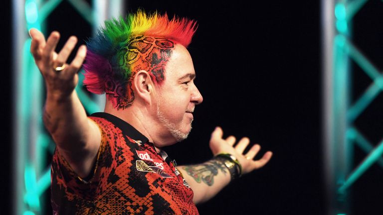 Peter Wright dazzled with a rainbow mohawk at last year's Players Championship Finals in Minehead