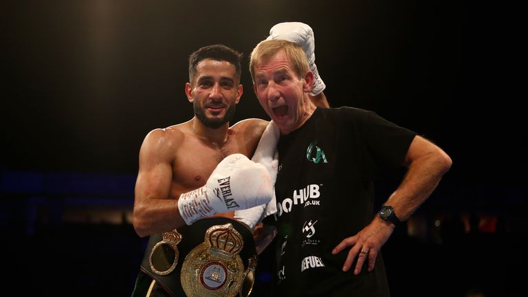 Qais Ashfaq celebrates with his trainer Kelyvn Travis