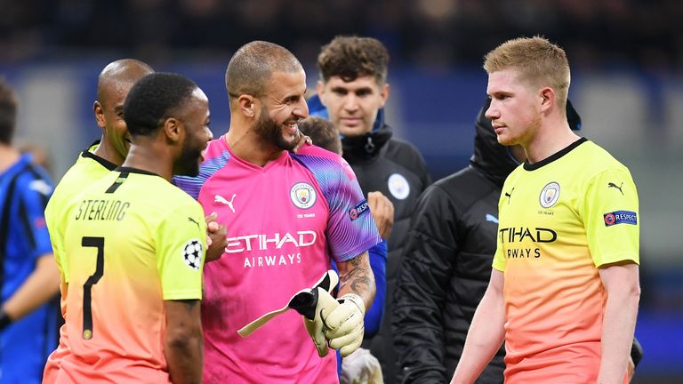 Walker is all smiles with Raheem Sterling but Kevin De Bruyne didn't look convinced