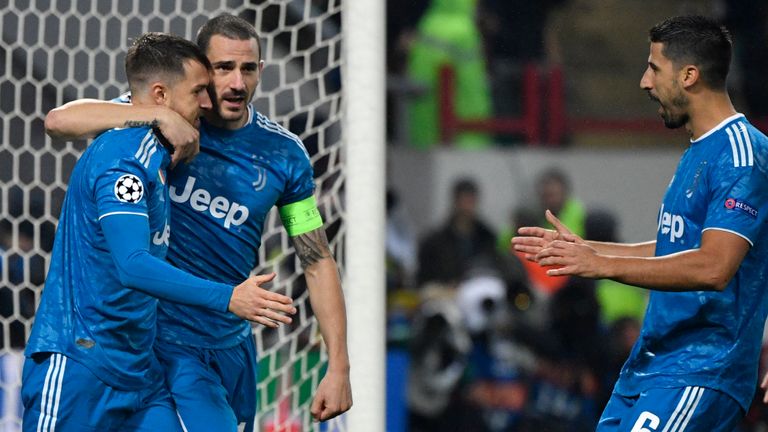Juventus' Welsh midfielder Aaron Ramsey celebrates with teammates