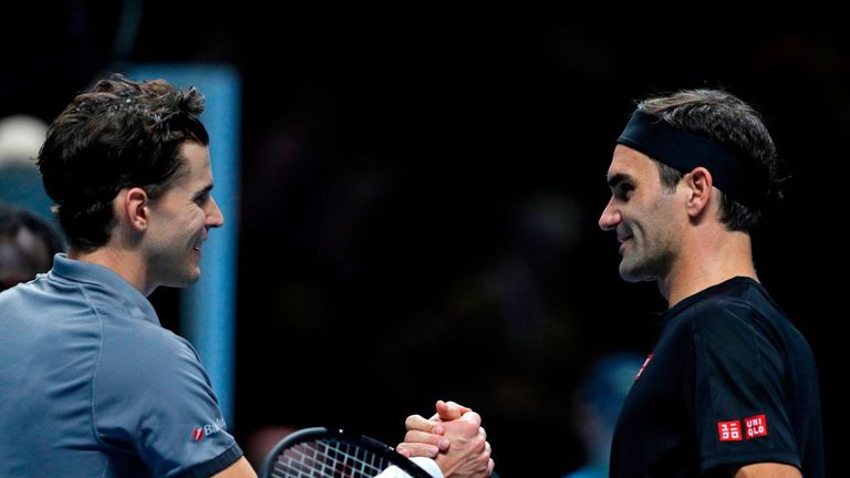 Dominic Thiem shakes hands with Switzerland&#39;s Roger Federer after his straight sets win in their men&#39;s singles round-robin match on day one of the ATP World Tour Finals