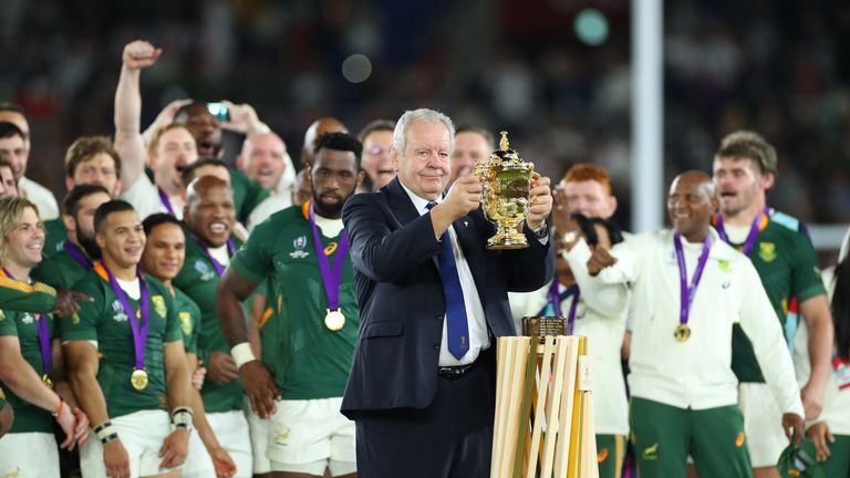 Bill Beaumont, Chairman of World Rugby, shows the Webb Ellis Cup prior to presenting the trophy to South Africa captain Siya Kolisi