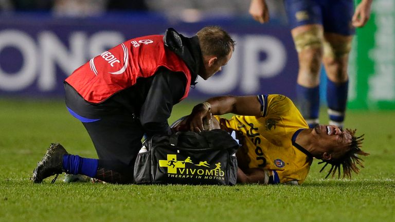 Anthony Watson of Bath Rugby gets treatment during the Heineken Champions Cup Round 2 match between Harlequins and Bath Rugby at Twickenham Stoop on November 23, 2019 in London, England