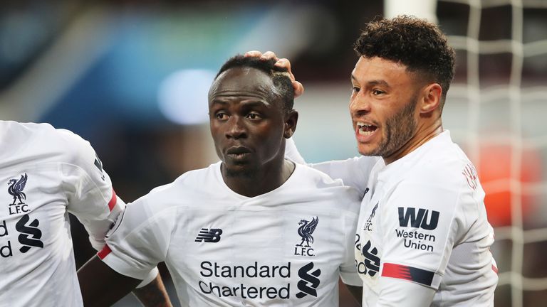 Sadio Mane celebrates his winning goal with Alex Oxlade-Chamberlain