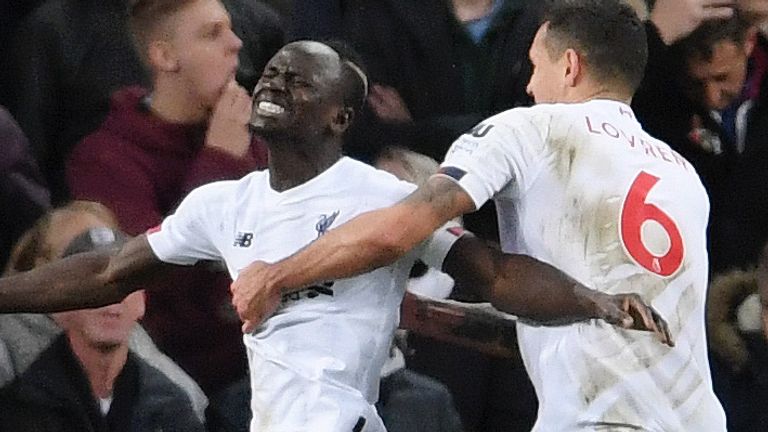 Sadio Mane celebrates his winner at Villa Park