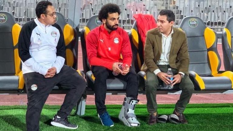 Mohamed Salah wearing a protective boot as he is sidelined from Egypt training