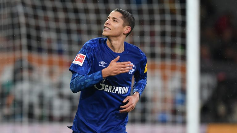 Schalke's French midfielder Amine Harit reacts after scoring during the German first division Bundesliga football match between FC Augsburg and FC Schalke 04 on November 3, 2019