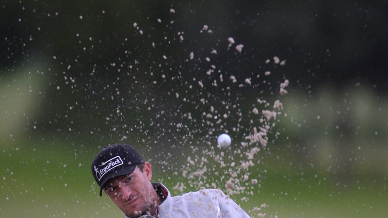 Sebastian Heisele of Germany chips onto the 12th green during day 4 of the Challenge Tour Grand Final at Club de Golf Alcanada