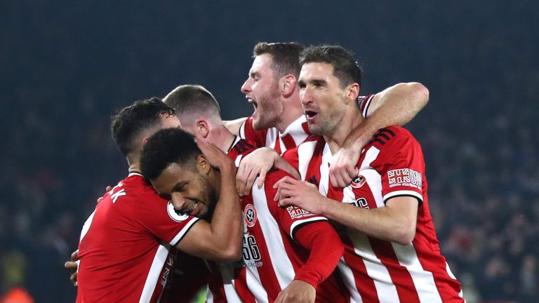 Lys Mousset celebrates with his Sheffield United team-mates after scoring against Manchester United at Bramall Lane