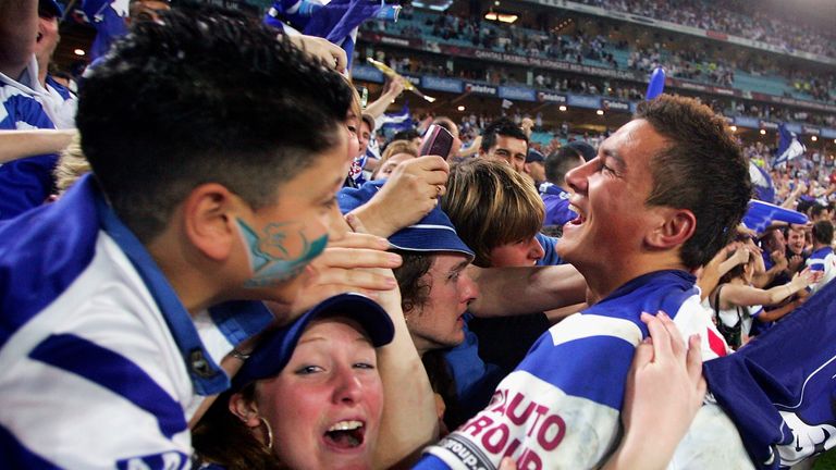 SYDNEY, AUSTRALIA - OCTOBER 3: Sonny Bill Williams ofthe Bulldogs celebrates with fans after defeating the Roosters during the NRL Grand Final  between the Sydney Roosters and the Bulldogs held at Telstra Stadium, October 3, 2004 in Sydney, Australia. (Photo by Chris McGrath/Getty Images) *** Local Caption *** Sonny Bill Williams 