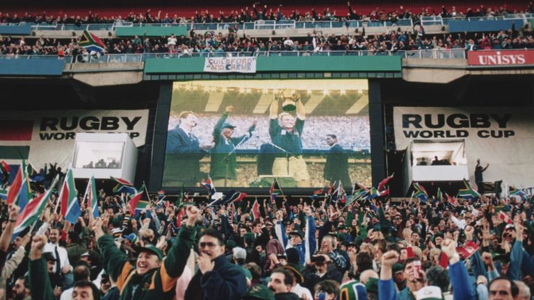 South African fans watch Francois Pienaar lift the trophy in 1995