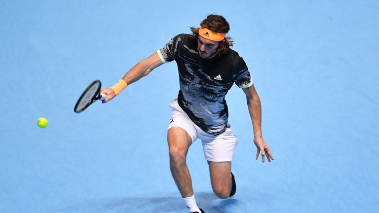 Stefanos Tsitsipas of Greece plays a backhand in his singles match against Alexander Zverev of Germany during Day Four of the Nitto ATP World Tour Finals at The O2 Arena on November 13, 2019 in London, England. 