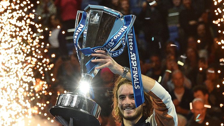 Stefanos Tsitsipas poses with the winner's trophy after winning the men's singles final match on day eight of the ATP World Tour Finals tennis tournament at the O2 Arena in London on November 17, 2019.