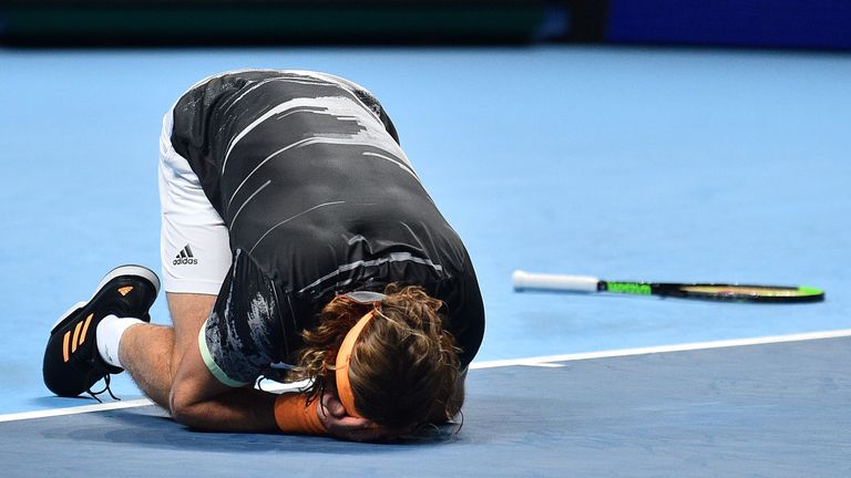 Stefanos Tsitsipas collapsed to his knees after two hours and 35 minutes 