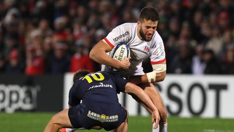 Ulster Rugby's Stuart McCloskey is tackled by Clermont Auvergne's Jake McIntyre