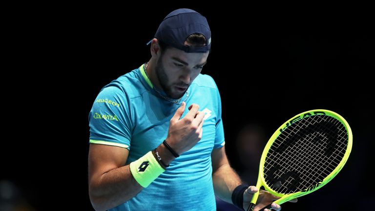 Matteo Berrettini in action against Roger Federer at the ATP Finals 