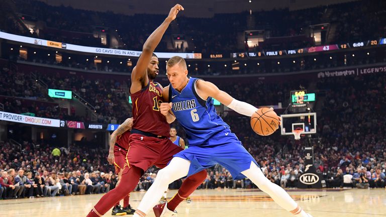 Tristan Thompson of the Cleveland Cavaliers tries to guard Kristaps Porzingis of the Dallas Mavericks