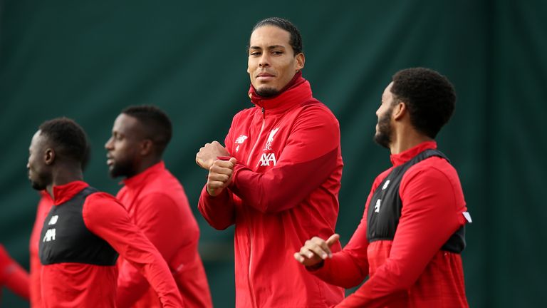Virgil van Dijk chats with Joe Gomez during a Liverpool training session